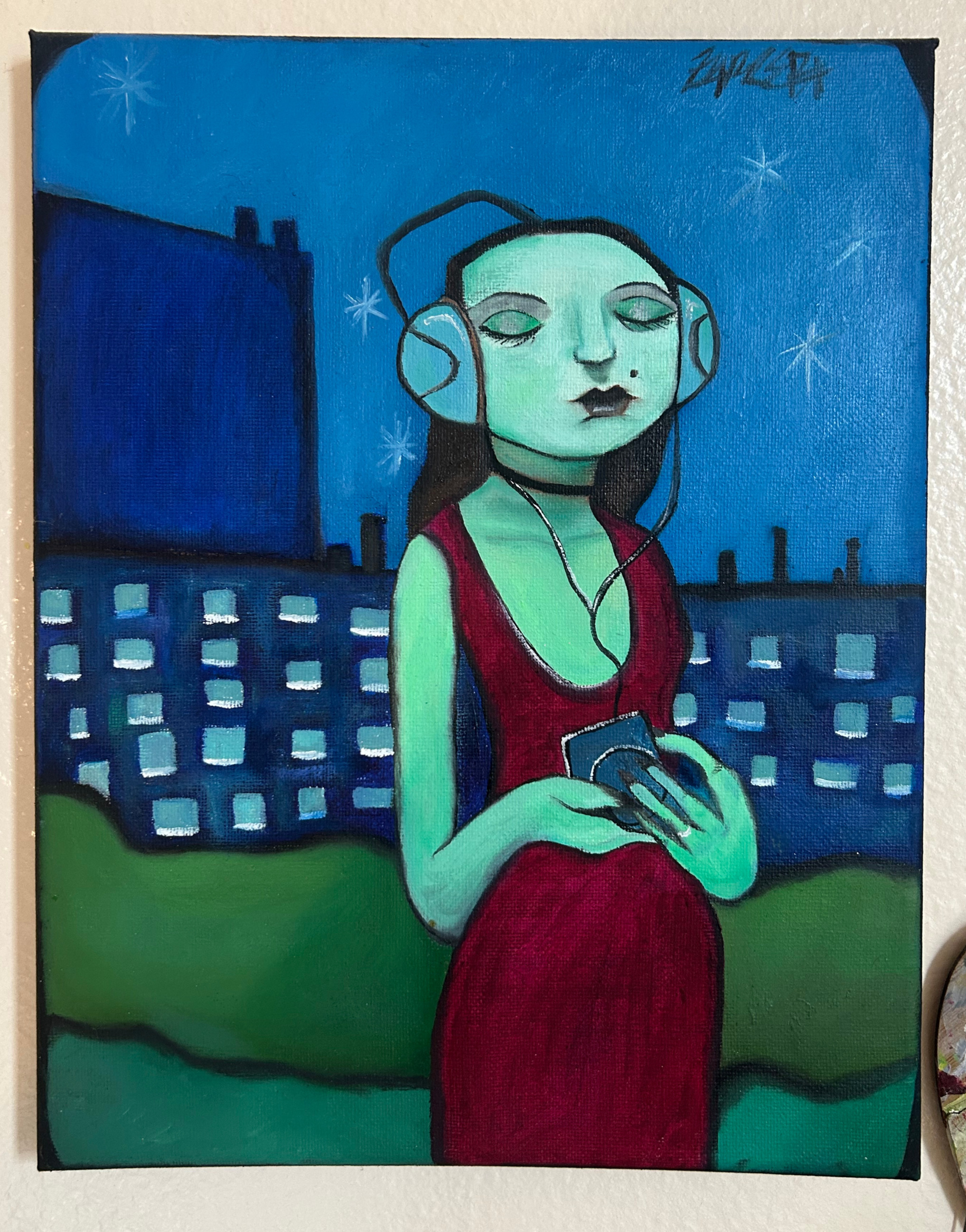 Figure wearing headphones beneath a blue night sky